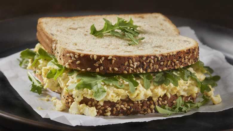 egg salad sandwich with arugula