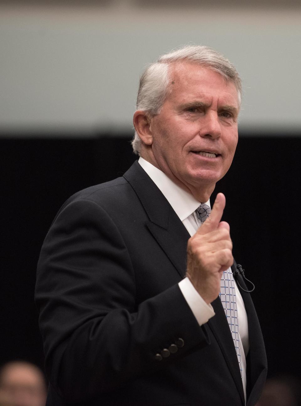 Spring Lake resident Jack Ford lectures the crowd at Monmouth University in 2017 about the influence of money on college athletics.