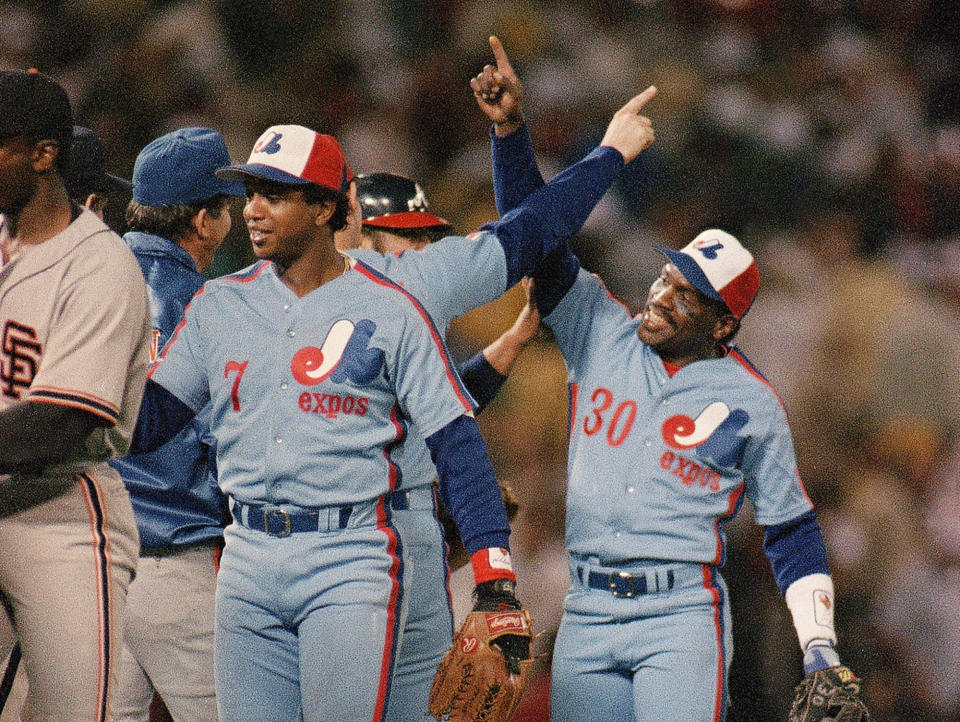 FILE - In this Tuesday, July 15, 1987, file photo, All-Star baseball game Most Valuable Player Tim Raines (30) of the Montreal Expos celebrates the National League's 2-0 victory over the American League with his teammates at Oakland Coliseum, in Oakland, Calif. Raines started wearing the tricolor cap as a teen and proudly sported the Montreal Expos logo for years, all the way onto his Hall of Fame plaque. Now known as the Washington Nationals, the team is set to play in the franchise's first World Series. (AP Photo/Lenny Ignelzi, File)