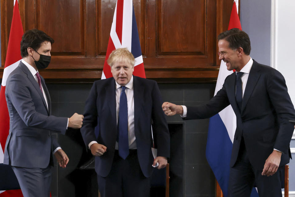 From left, Canadian Prime Minister Justin Trudeau, British Prime Minister Boris Johnson and Dutch Prime Minister Mark Rutte greet each other during a meeting at RAF Northolt RAF Northolt in London, Monday, March 7, 2022. (Henry Nicholls, Pool via AP)