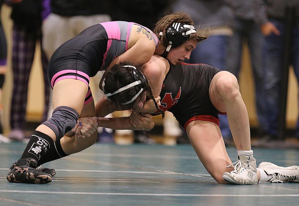 Somerville's Valarie Maldonado (top) wrestles Kingsway's Reagan Roxas in the East Brunswick Lady Bear Invitational on Dec. 23, 2023