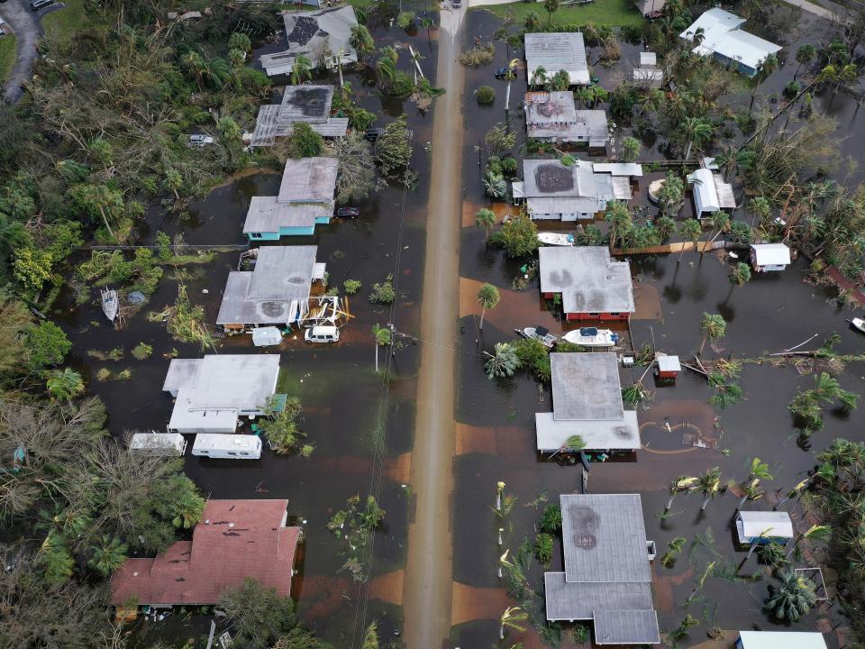 In this aerial view, flooded homes are shown after Hurricane Ian moved through the Gulf Coast of Florida on September 29, 2022 in Port Charlotte, Florida.