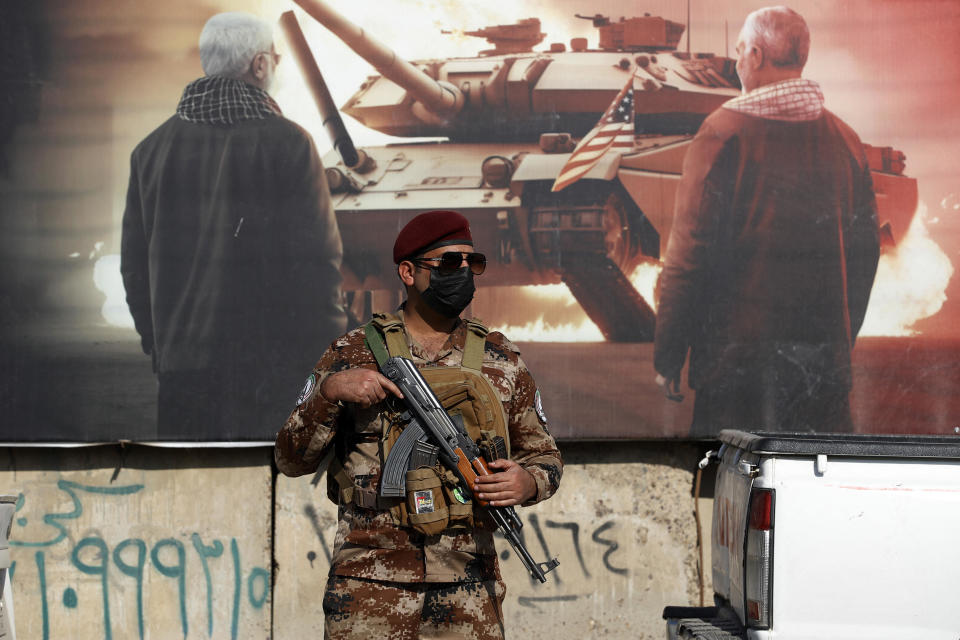 A paramilitary of the Hashed al-shaabi (Popular Mobilisation) forces stands guard during the funeral of a comrade who died in U.S. airstrikes targeting Iran-backed groups in Iraq the day before, at the group's headquarters in Baghdad on Jan. 25, 2024.  / Credit: AHMAD AL-RUBAYE/AFP via Getty Images