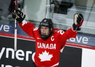 Canada's Marie-Philip Poulin celebrates her overtime goal against the United States during the IIHF hockey women's world championships title game in Calgary, Alberta, Tuesday, Aug. 31, 2021. (Jeff McIntosh/The Canadian Press via AP)