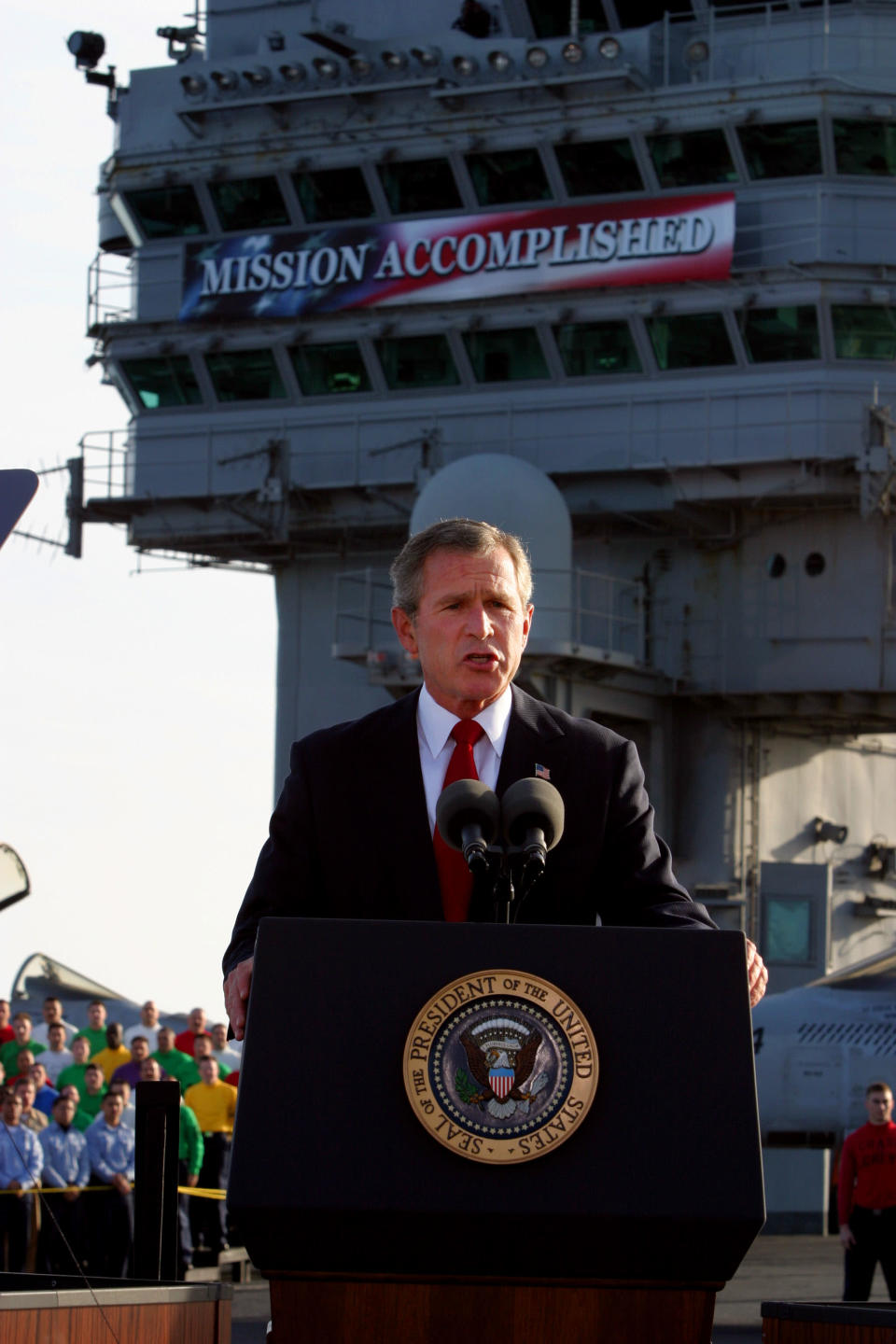 In this May 1, 2003, file photo, President Bush declares the end of major combat in Iraq as he speaks aboard the aircraft carrier USS Abraham Lincoln off the California coast. The White House said Wednesday, April 30, 2008, that President Bush has paid a price for the "Mission Accomplished" banner that was flown in triumph five years ago but later became a symbol of U.S. misjudgments and mistakes in the long and costly war in Iraq. (AP Photo/J. Scott Applewhite)