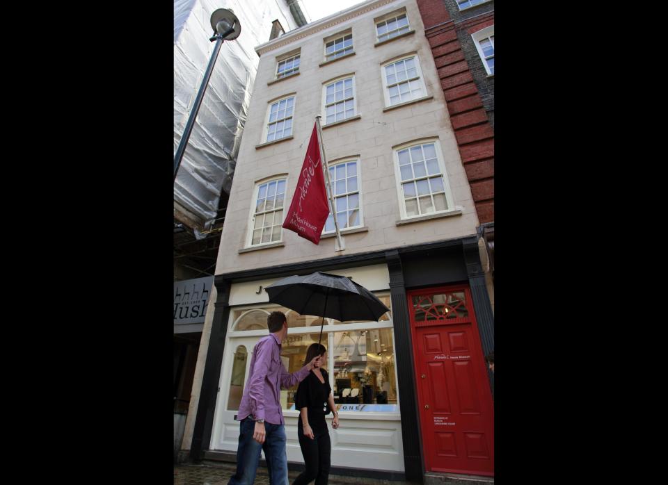 People walk past a Georgian house, turned into a museum where composer George Frideric Handel lived, where an exhibition devoted to Jimi Hendrix is being held, in central London. They were both immigrants in Britain who changed the face of music, one with a harpsichord and a composer's pen, the other with an electric guitar. George Frideric Handel and Jimi Hendrix also shared an address, living 200 years apart in adjoining 18th-century London houses. Now, 40 years after Hendrix's death, a new exhibition about his London years brings these two unlikely neighbors together. Handel lived at 25 Brook Street, a Georgian house in the tony Mayfair area for 36 years until his death in 1759. The museum devoted to his life uses the adjoining upstairs apartment where Hendrix lived as offices. \  AP Photo/Lefteris Pitarakis 