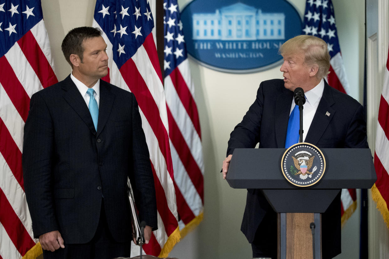 President Donald Trump speaks as Kris Kobach, Kansas secretary of state, listens during the initial meeting of the Presidential Advisory Commission on Election Integrity at the Eisenhower Executive Office Building in Washington, D.C., on July 19. Trump created the advisory commission in May, after claiming without evidence that 3 million people or more illegally voted for Hillary Clinton. (Photo: Bloomberg via Getty Images)