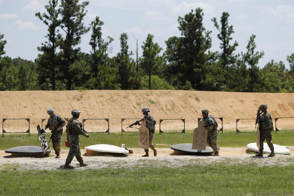 Soldiers prepare to leave a firing range at Fort Bragg in North Carolina on Tuesday, July 30, 2019. The area where guns are fired and bombs are detonated is ideal habitat for the rare St. Francis' satyr butterfly. (AP Photo/Robert F. Bukaty)