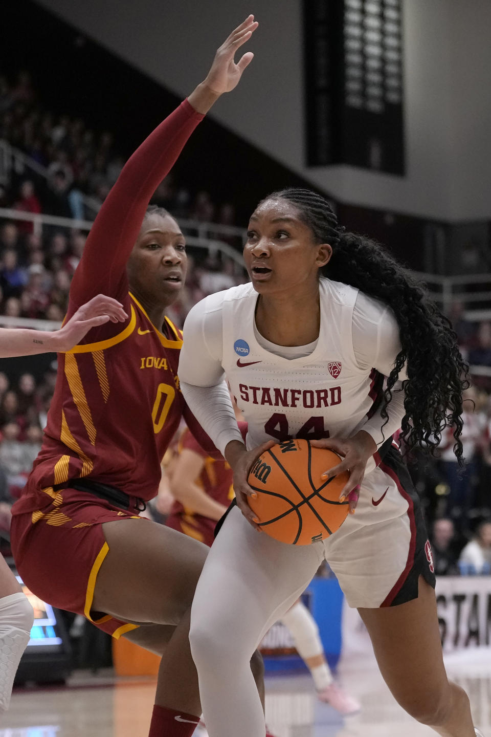 Stanford forward Kiki Iriafen (44) drives to the basket against Iowa State center Isnelle Natabou (0) during the first half of a second-round college basketball game in the women's NCAA Tournament in Stanford, Calif., Sunday, March 24, 2024. (AP Photo/Jeff Chiu)