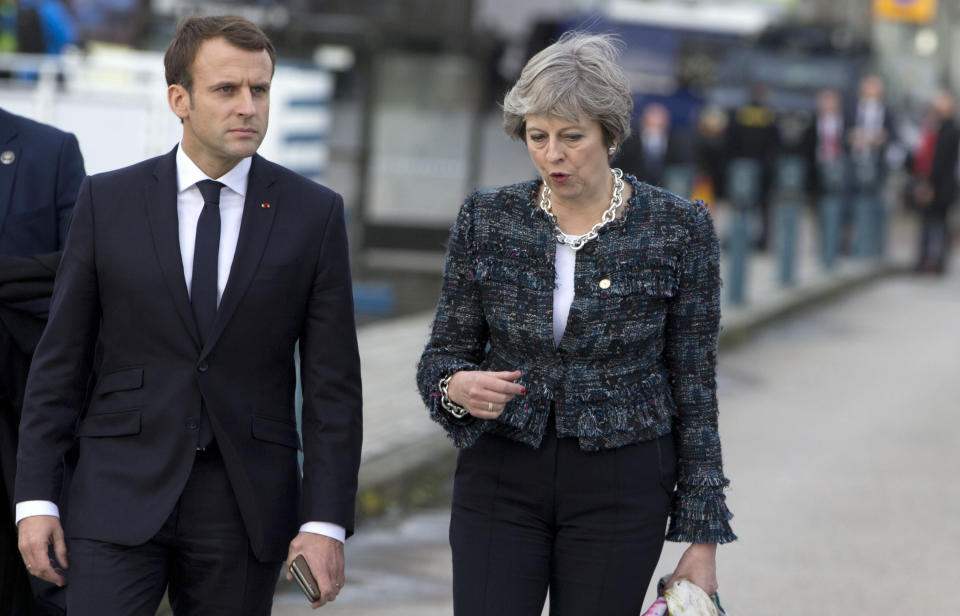 Prime Minister Theresa May speaks with French President Emmanuel Macron at an EU summit in Gothenburg, Sweden on Friday (AP Photo/Virginia Mayo)