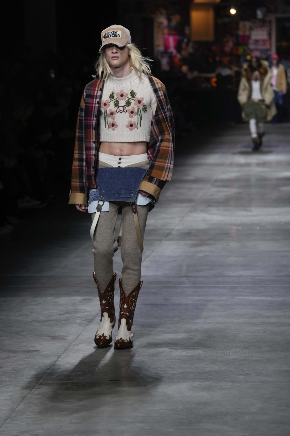 A model wears a creation as part of the DSquared2 menswear Fall-Winter 2023-24 collection presented in Milan, Italy, Friday, Jan. 13, 2023. (AP Photo/Antonio Calanni)