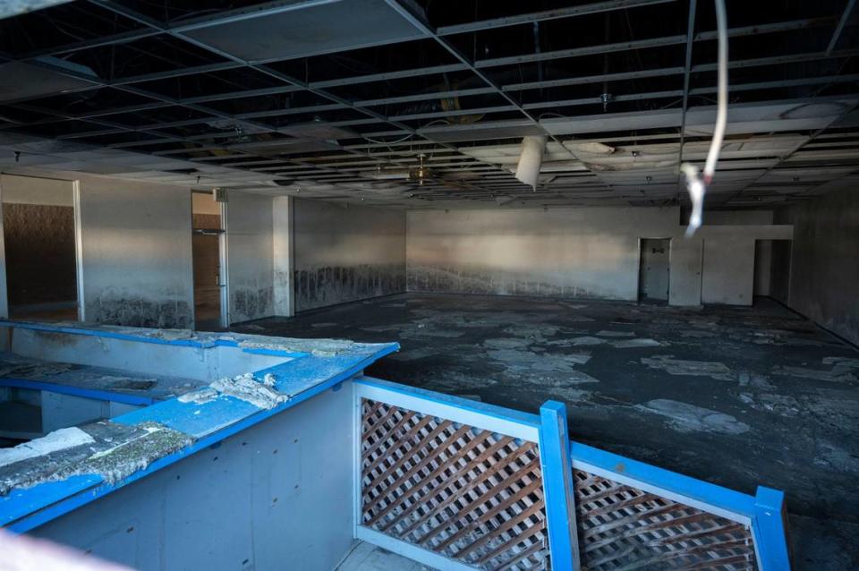 Water damage is apparent on the walls of the Excel Video shop in the former Peach Tree Mall in Linda on Thursday as the demolition of the structure is underway. Renamed the Feather River Center, the mall never recovered from the disaster, caused by a levee break on the Yuba River.