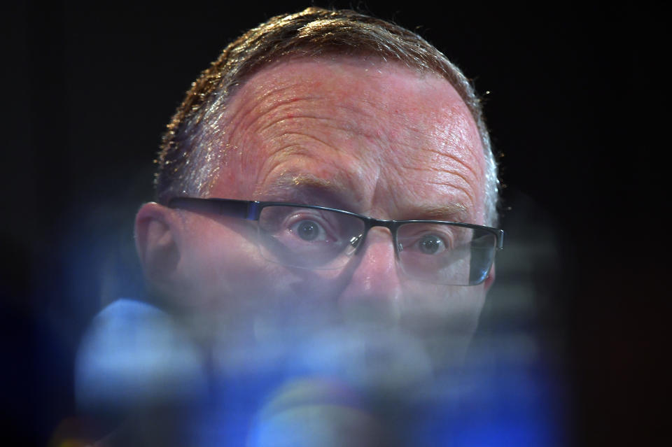 Stylised photograph of RBA governor Philip Lowe, which sees bottom half of his face blurred. 