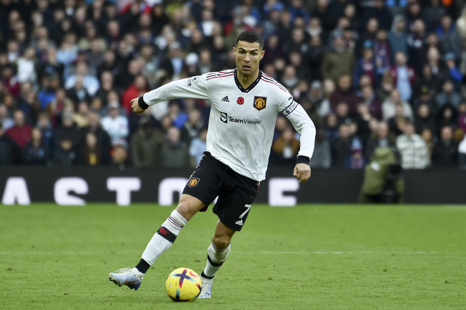 Manchester United's Cristiano Ronaldo runs with the ball during the English Premier League soccer match between Aston Villa and Manchester United at Villa Park in Birmingham, England, Sunday, Nov. 6, 2022. (AP Photo/Rui Vieira)