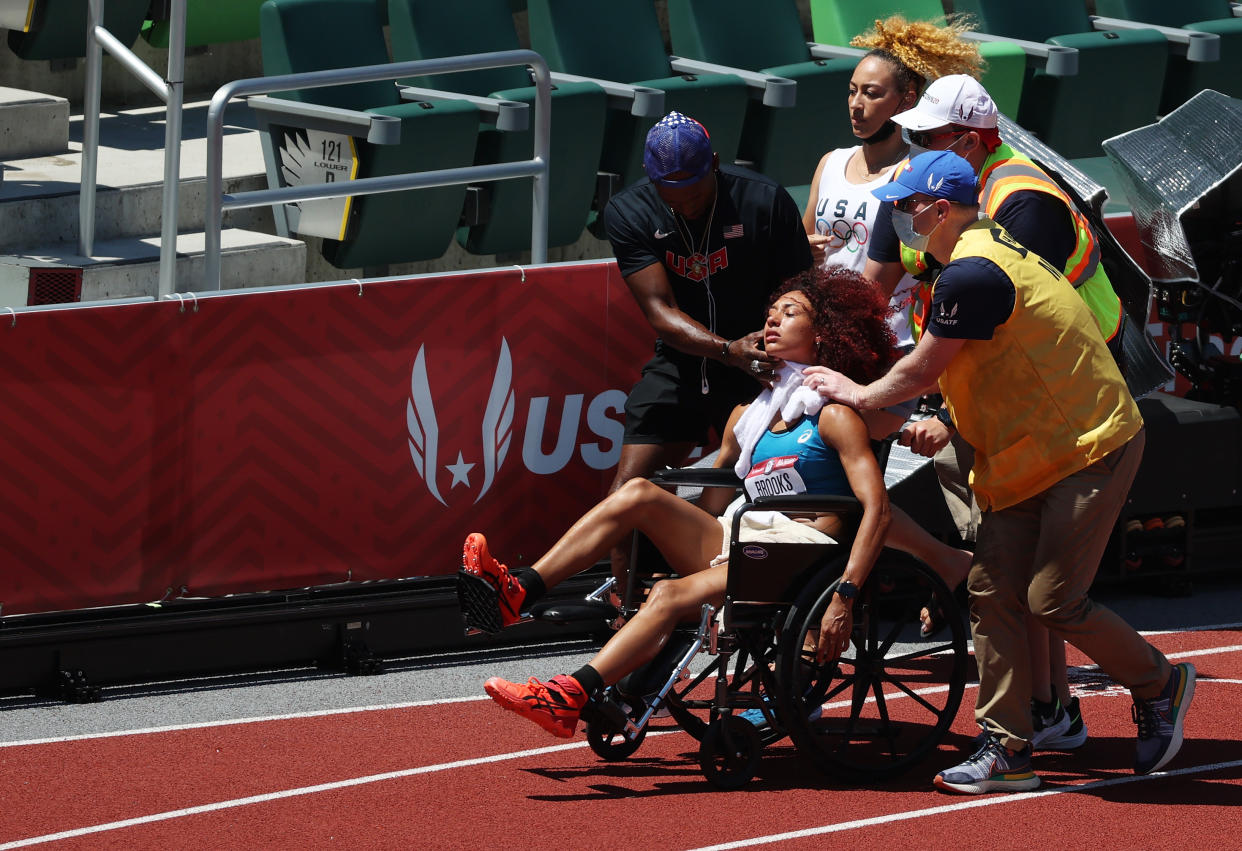 EUGENE, OREGON - JUNE 27: Taliyah Brooks is taken off of the track after collapsing ahead of the Women's Heptathlon Javelin during day ten of the 2020 U.S. Olympic Track & Field Team Trials at Hayward Field on June 27, 2021 in Eugene, Oregon. (Photo by Cliff Hawkins/Getty Images)