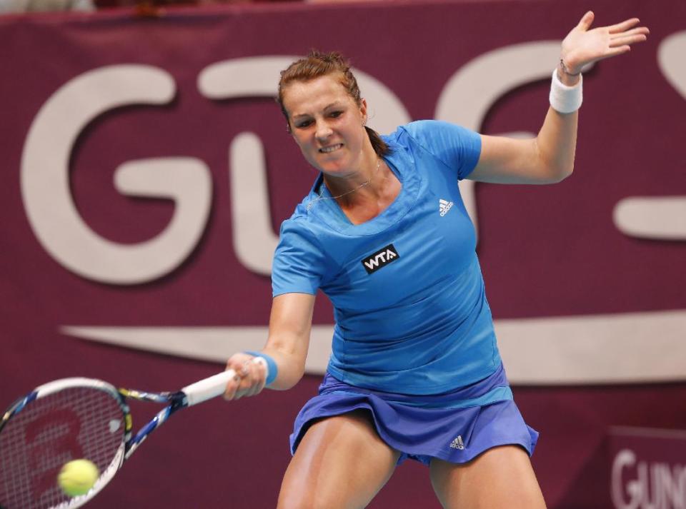 Anastasia Pavlyuchenkova of Russia returns the ball to Maria Sharapova of Russia during the semifinal match of the 22st Gaz de France WTA Open 2014 tennis tournament at Coubertin stadium, in Paris, Saturday, Feb. 1, 2014. (AP Photo/Jacques Brinon)