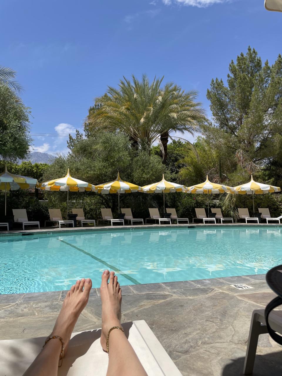 Lara's feet by the pool