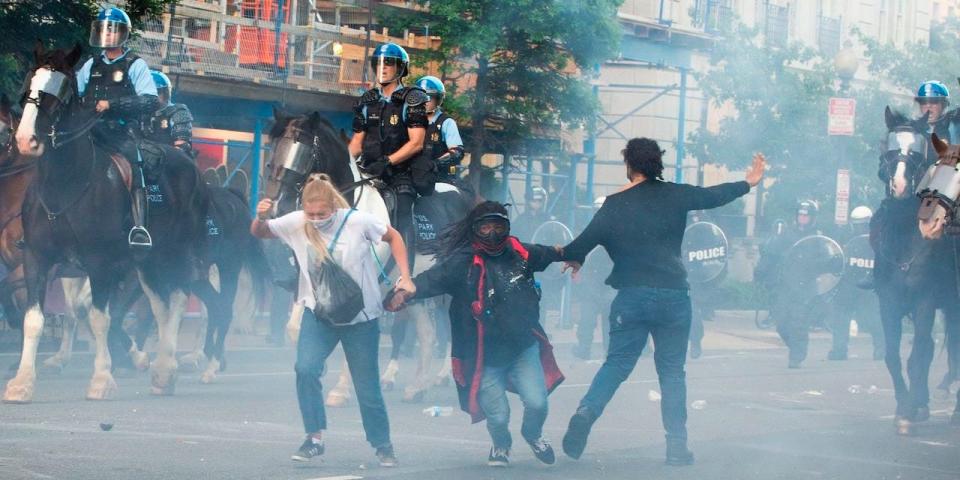 Protestors are tear gassed as the police disperse them near the White House on June 1, 2020 as demonstrations against George Floyd's death continue.