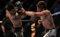 LAS VEGAS, NV - MAY 26: Mike Brown (right) punches Daniel Pineda during a light featherweight bout at UFC 146 at MGM Grand Garden Arena on May 26, 2012 in Las Vegas, Nevada.