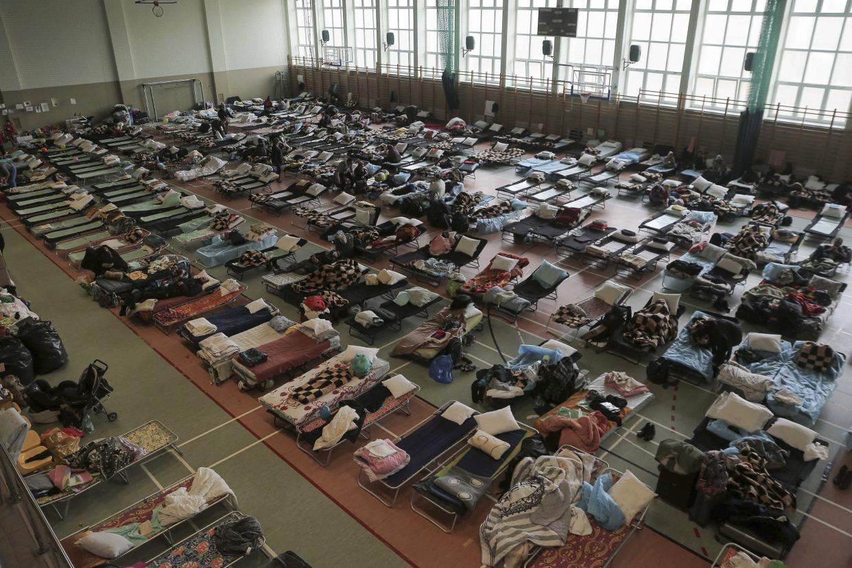 Hundreds of beds are placed inside a sports hall to accommodate Ukrainian refugees fleeing Russian invasion at the border crossing town of Medyka, Poland, on Tuesday, March 1, 2022. All day long, as trains and buses bring people fleeing Ukraine to the safety of Polish border towns, they carry not just Ukrainian fleeing a homeland under attack but large numbers of other citizens who had made Ukraine their home and whose fates too are now uncertain.