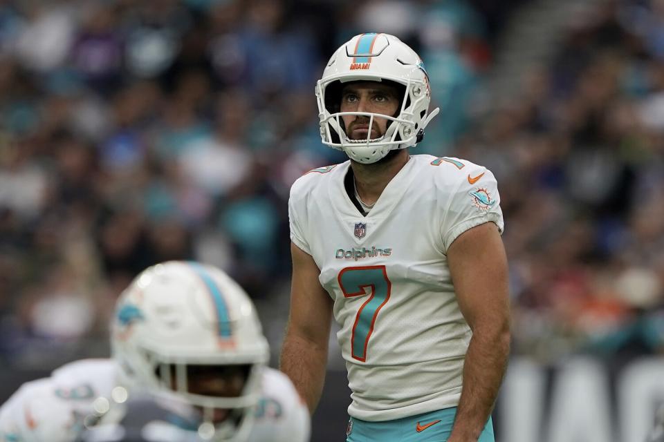 Miami Dolphins kicker Jason Sanders looks up before kicking a field goal.