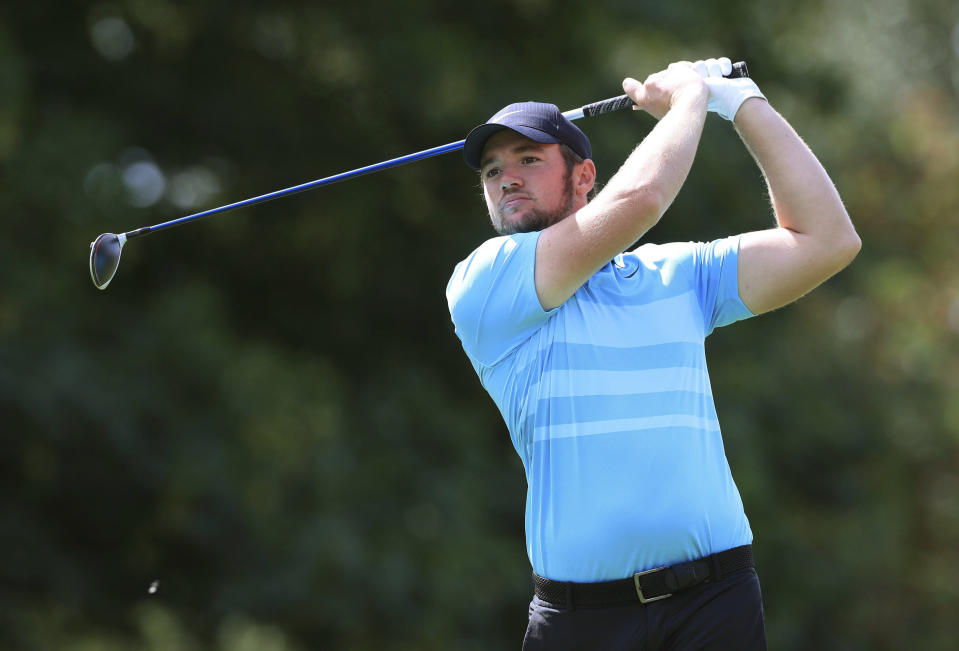 England's Sam Horsfield tees off on the 10th hole, during day four of the Hero Open, in Birmingham, England,  Sunday, Aug. 2, 2020. Horsfield shot a final round 4-under 68 to win the Hero Open by one stroke Sunday in the European Tour’s latest stop in England. The 23-year-old Englishman clinched his first European Tour title with an 18-under 270 total, holding off second-place Thomas Detry, whose 6-under 66 had briefly given him a share of the lead. (Mike Egerton/PA via AP)