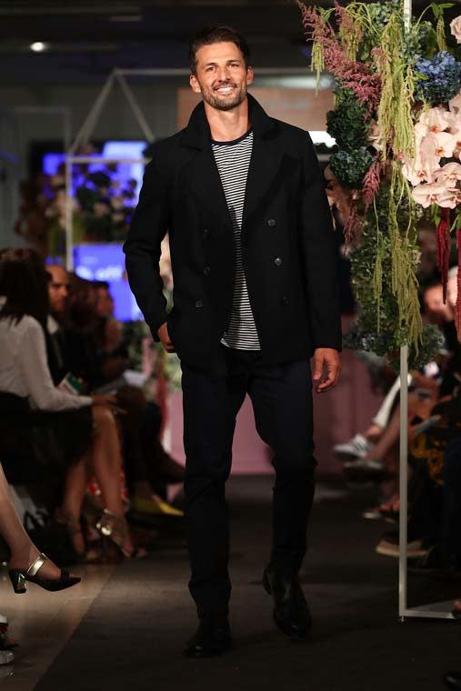 Tim looked at ease on the runway in this Autumn ensemble, flashing a smile for the camera as his girlfriend, Anna Heinrich looked on.