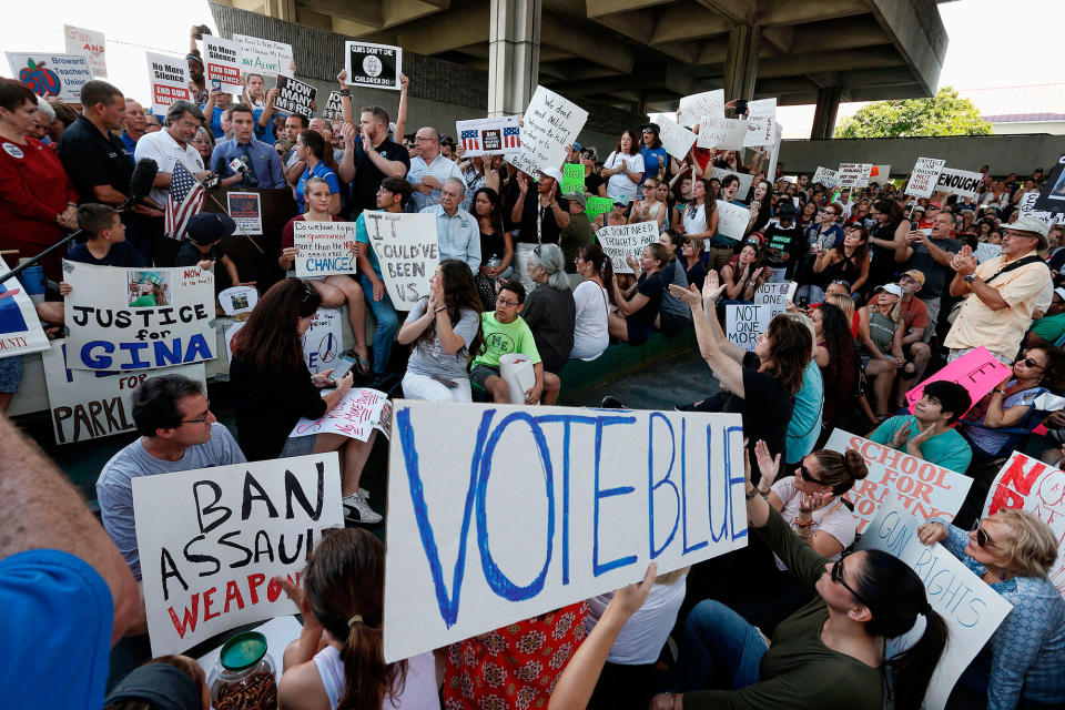 <p>Protesters hold signs at a rally for gun control at the Broward County Federal Courthouse in Fort Lauderdale, Fla., on Feb. 17, 2018. (Photo: Rhona Wise/AFP/Getty Images) </p>