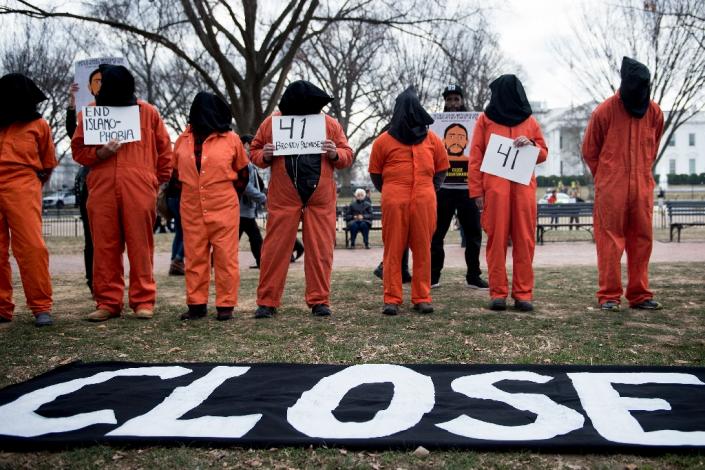 Activists protest the Guantanamo Bay detention camp outside the White House on January 11, the 16th anniversary of the US military's War-on-Terror prison in Cuba (AFP Photo/Brendan Smialowski)