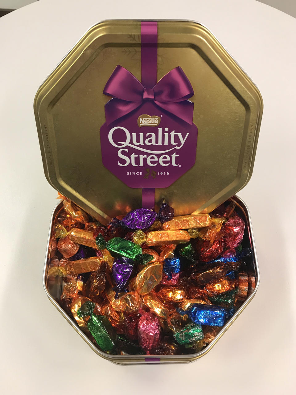 A tin of Nestle Quality Street chocolates with plastic wrappers. (Photo by Martin Keene/PA Images via Getty Images)