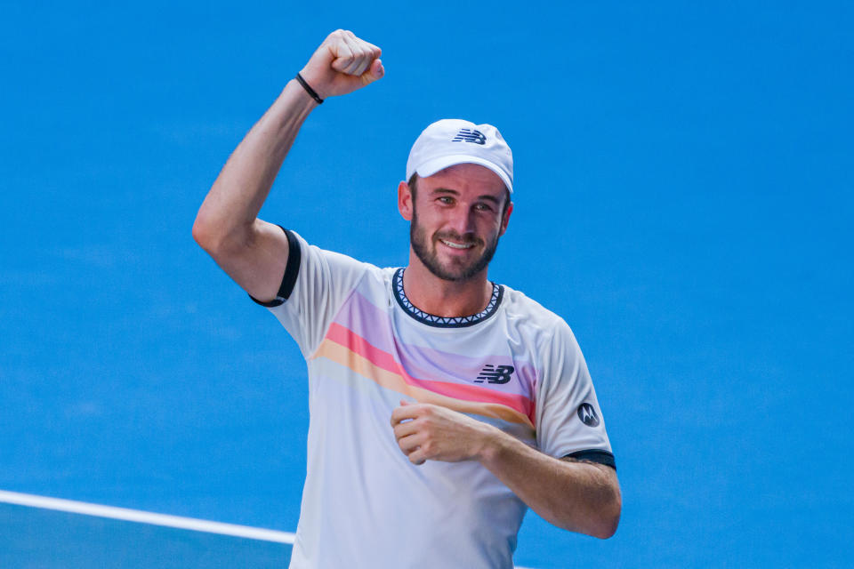 MELBOURNE, AUSTRALIA - JANUARY 25: Tommy Paul of the United States celebrates victory in the Quarterfinal singles match against Ben Shelton of the United States during day ten of the 2023 Australian Open at Melbourne Park on January 25, 2023 in Melbourne, Australia. (Photo by Andy Cheung/Getty Images)