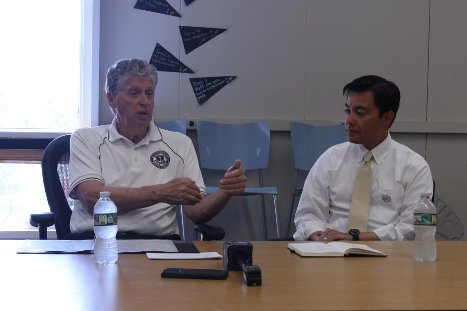 Governor Dan McKee, Mayor Xay Khamsyvoravong and several other community leaders at a press conference on improvements to the Florence Gray Center to be made through the statewide Community Learning Center Initiative.