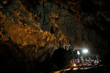 Journalists work in Tham Luang caves during a search for 12 members of an under-16 soccer team and their coach, in the northern province of Chiang Rai, Thailand, June 27, 2018. REUTERS/Soe Zeya Tun