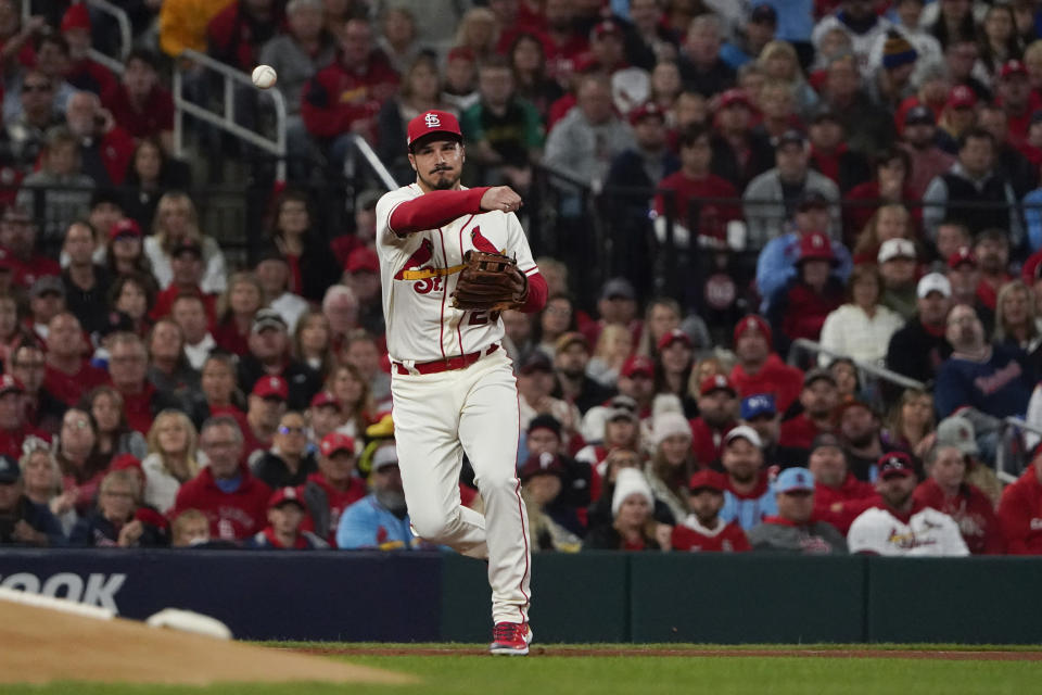 St. Louis Cardinals' Nolan Arenado throws out Philadelphia Phillies' Rhys Hoskins during the first inning in Game 2 of an NL wild-card baseball playoff series Saturday, Oct. 8, 2022, in St. Louis. (AP Photo/Jeff Roberson)