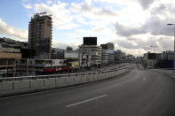 A highway is almost empty of cars during a lockdown aimed at curbing the spread of the coronavirus, in Beirut, Lebanon, Friday, Jan. 15, 2021. Lebanon's parliament has approved a draft law to allow the importing of vaccines into the tiny country to fight the spread of coronavirus. (AP Photo/Bilal Hussein)