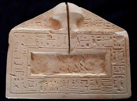 An artifact is displayed during the presentation of a new discovery in the Monkey Valley near the Valley of the Kings in Luxor
