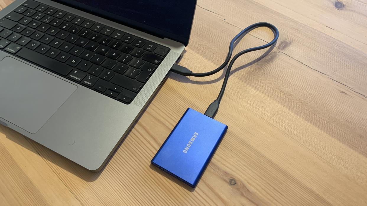  Samsung T7 SSD connected to a laptop. 