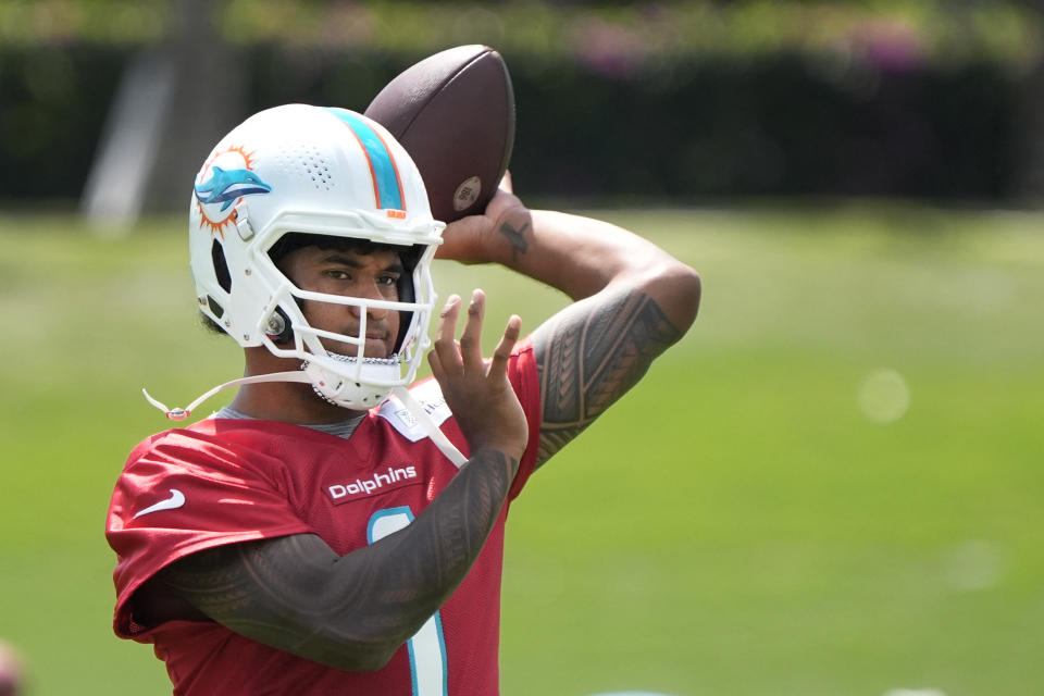 Miami Dolphins quarterback Tua Tagovailoa throws during NFL football practice at the team's practice facility, Tuesday, June 4, 2024, in Miami Gardens, Fla. (AP Photo/Wilfredo Lee)