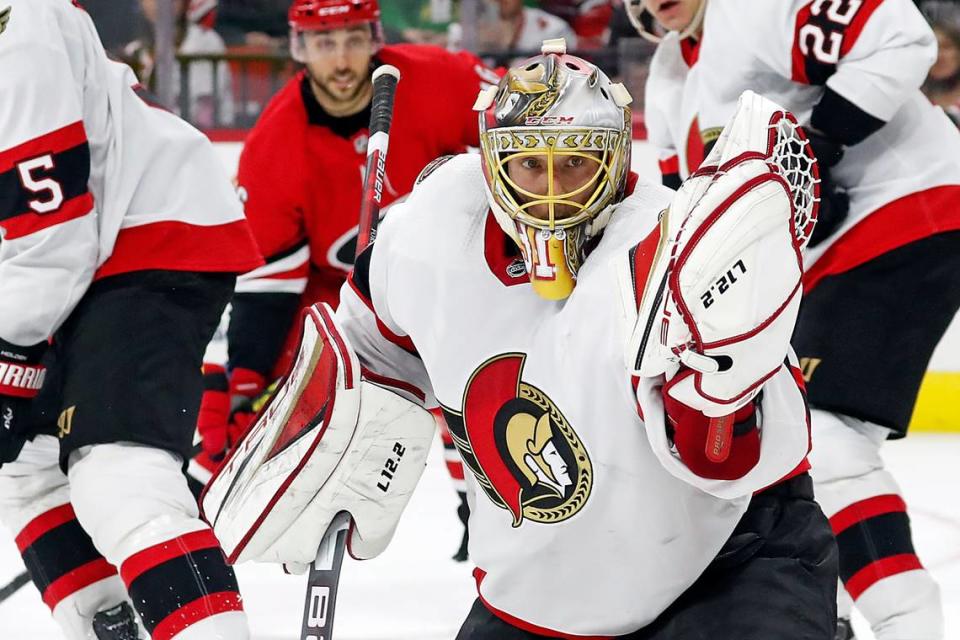 Ottawa Senators’ Anton Forsberg (31) watches the puck go into his glove during the second period of the team’s NHL hockey game against the Carolina Hurricanes in Raleigh, N.C., Thursday, Dec. 2, 2021. (AP Photo/Karl B DeBlaker)