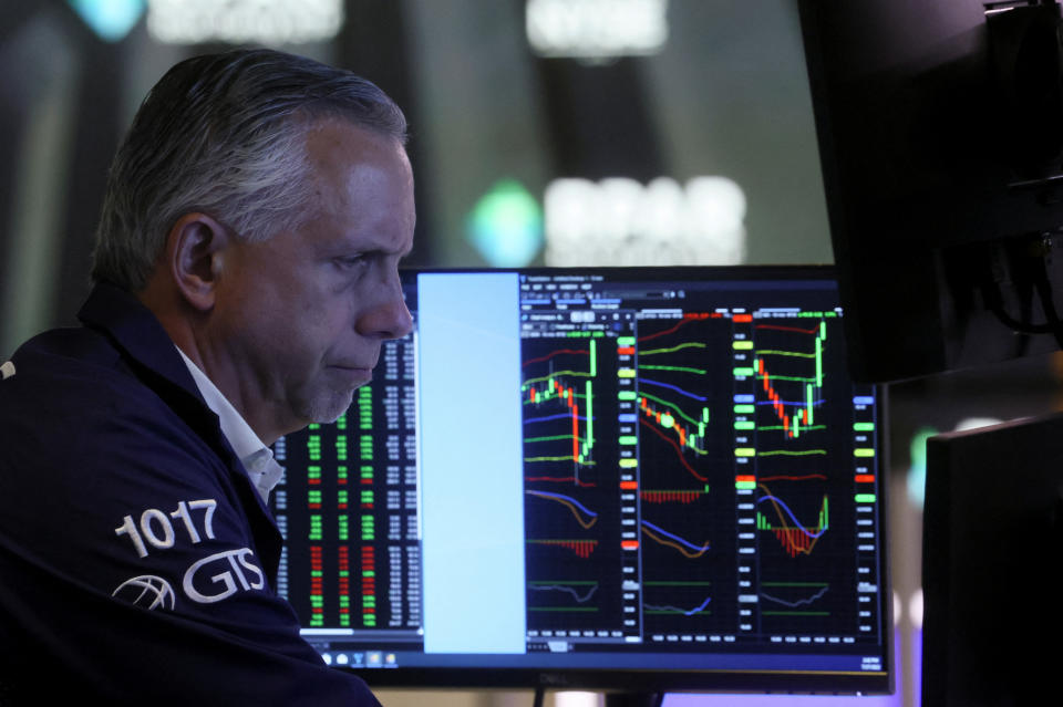 A trader works on the floor of the New York Stock Exchange (NYSE) after a Fed rate announcement, in New York City, U.S., July 27, 2022. REUTERS/Brendan McDermid