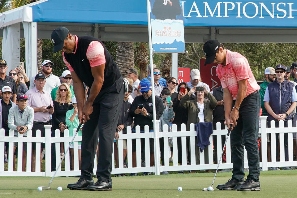 <p>Tiger and Charlie have eerily similar swings, likely from hours of practice done together. </p>