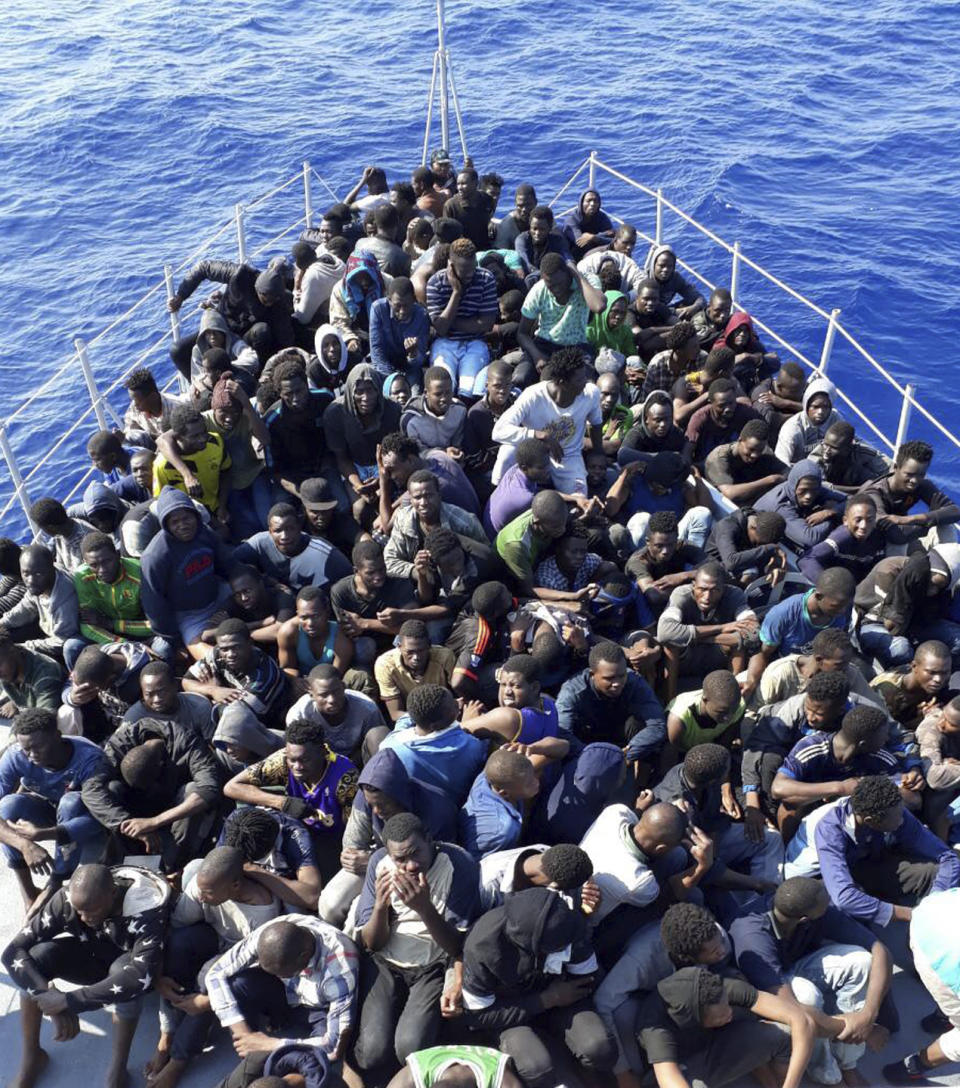 FILE - In this photo released by the Libyan coast guard, African migrants who were on boats in distress in the Mediterranean on their way to Europe, and rescued by the Libyan coast guard arrive to shore, east of the capital, Tripoli, Libya June 24, 2018. A confidential European Union military report calls for the continued support and training of Libya’s coastguard and navy despite concerns about their treatment of migrants, a mounting death toll at sea, and the continued lack of any central authority in the North African nation. The report circulated to EU officials on Jan. 4 and obtained by The Associated Press offers a rare insight into Europe’s determination to cooperate with Libya and its role in the interception and return of thousands of men, women and children to a country where they face insufferable abuse. (Libyan Coast Guard via AP)