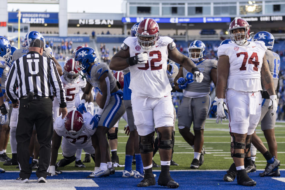 Alabama offensive lineman Tyler Booker (52) celebrates a touchdown during the second half of an NCAA college football game against Kentucky in Lexington, Ky., Saturday, Nov. 11, 2023. (AP Photo/Michelle Haas Hutchins)