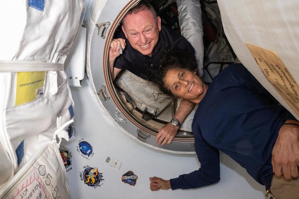 PHOTO: This NASA picture released on July 2, 2024 shows NASA's Boeing Crew Flight Test astronauts Wilmore and Williams inside the vestibule between the forward port on the International Space Station's Harmony module and Boeing's Starliner spacecraft.  (Handout/NASA/AFP via Getty Images)