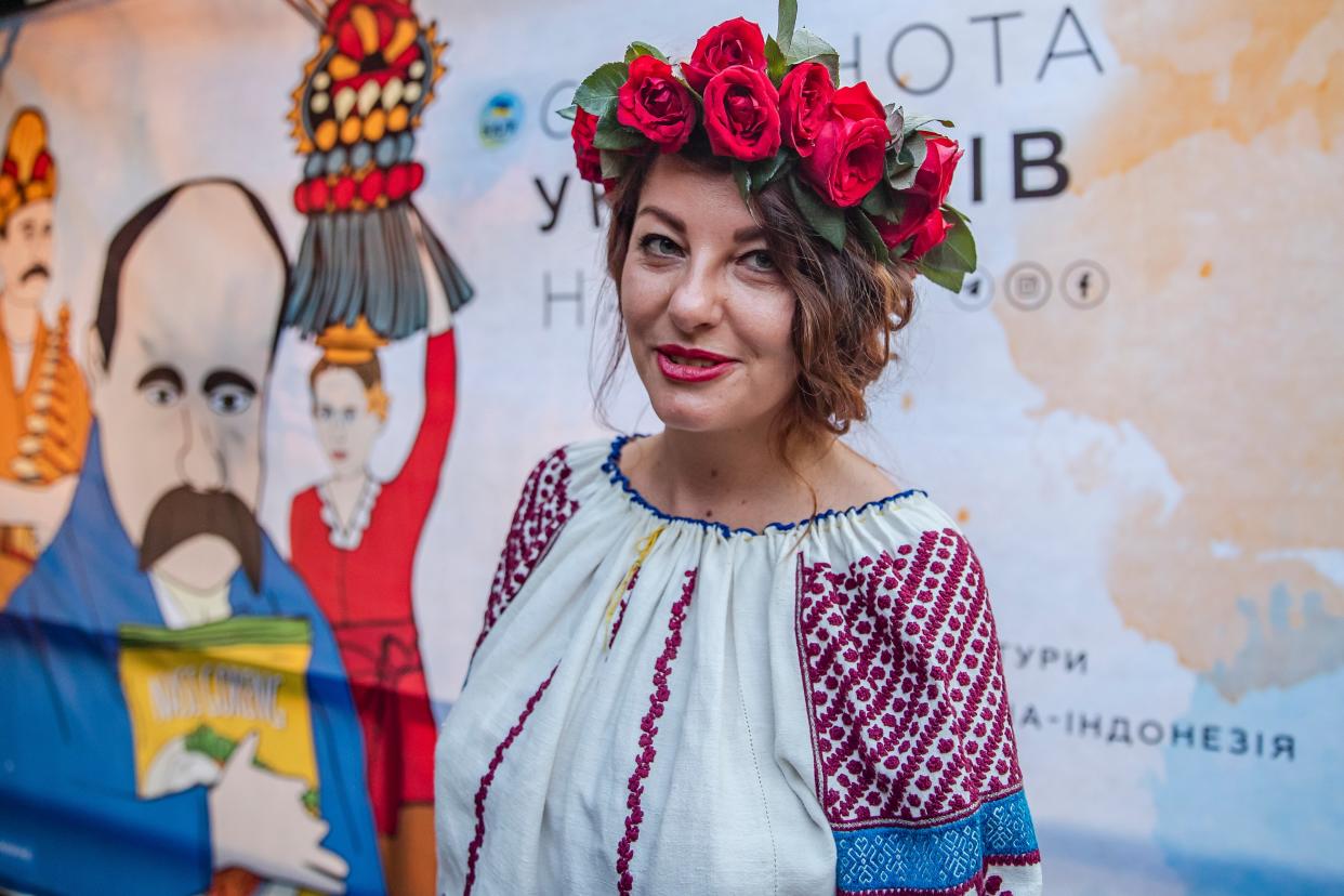 A Ukrainian woman wears traditional clothing as part of the Vyshyvanka day celebrations in Canggu, Bali, Indonesia (EPA)
