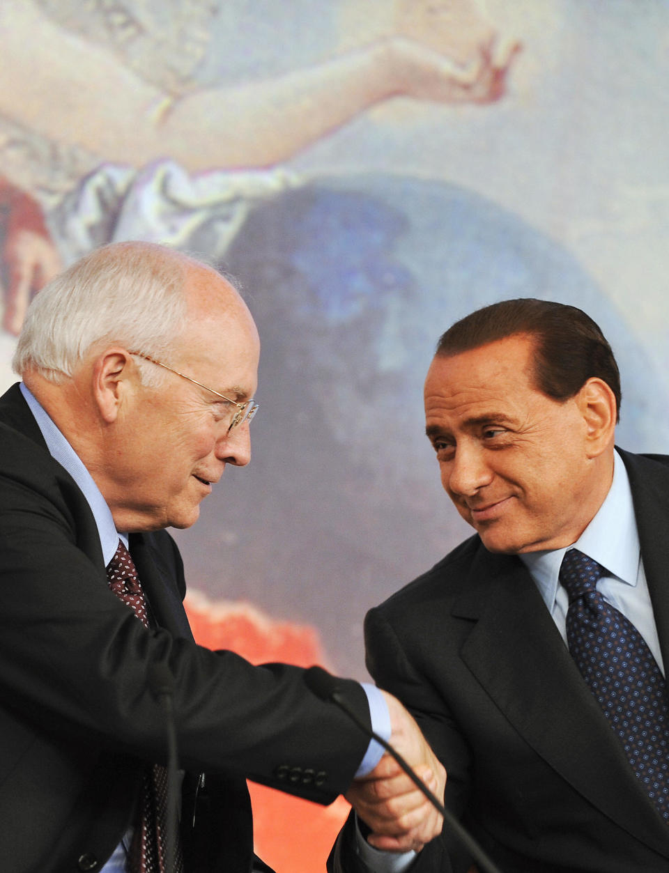 Italian Prime Minister Silvio Berlusconi (R) shakes hands with Vice President Dick Cheney after a joint press conference on September 9, 2008 in Rome's Palazzo Chigi. (FILIPPO MONTEFORTE/AFP/Getty Images)