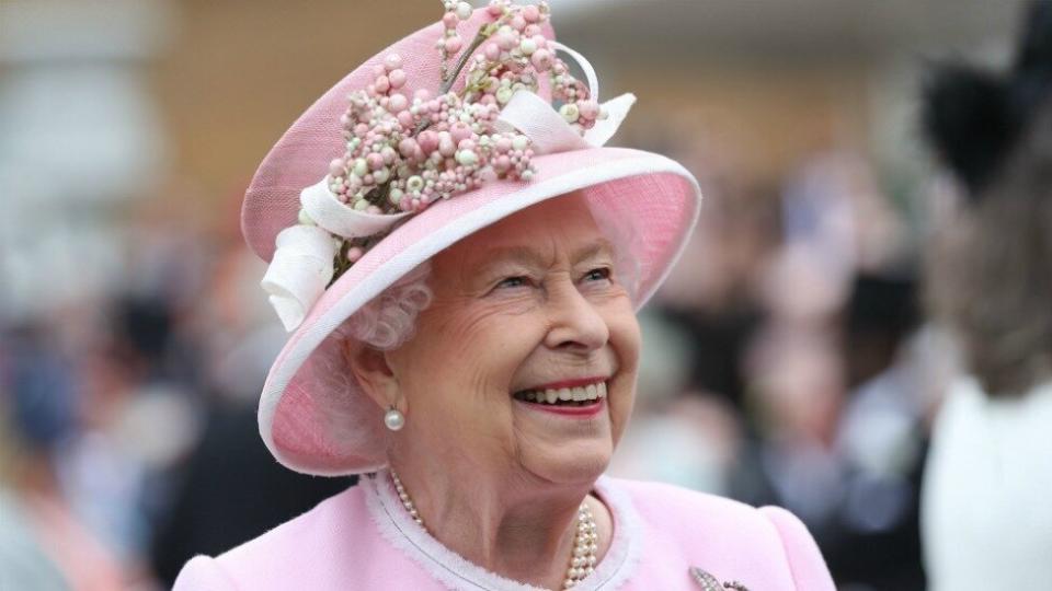 The Queen relaxed her own rules during a Buckingham Palace Garden Party when interacting with one lucky attendee. Photo: Getty Images