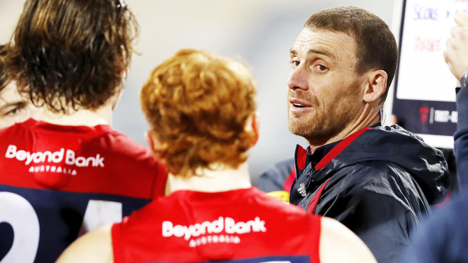 Simon Goodwin, pictured here addressing his players during the Demons' clash with Geelong. 