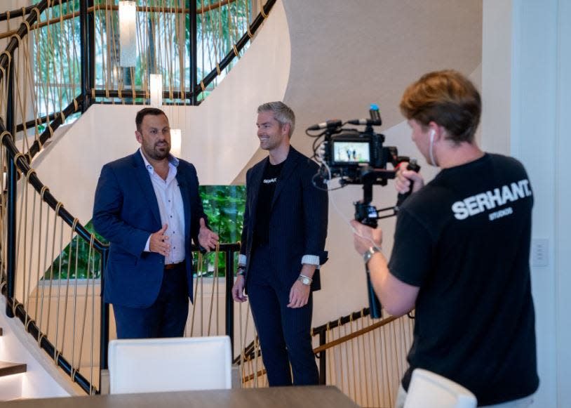 Christian Prakas (left) and former "Million Dollar Listing New York" star Ryan Serhant discuss the attributes of 526 North Ocean Boulevard in Delray Beach on Sept. 27, 2023 for a video promoting the home. Prakas is managing broker of Serhant's Delray Beach office.