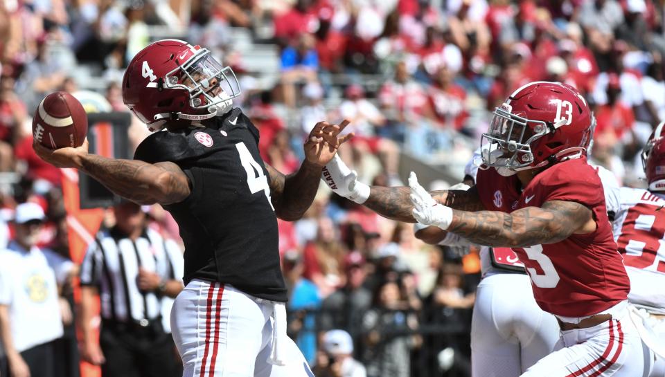 Quarterback Jalen Milroe (4) throws a pass during the Alabama spring game.